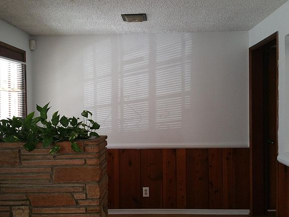 View from living room of front door (left) to entrance hallw