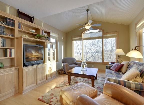 The cozy Hearth Room adjoins the kitchen and dinette area. Great views from all the windows!