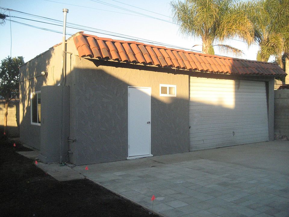 EXTERIOR OF HOUSE AND GARAGE