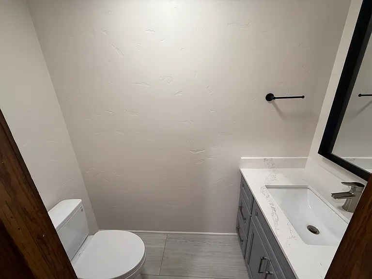 Powder room is tastefully appointed.