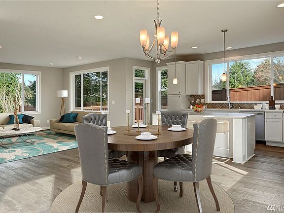 Spacious great room opens to gourmet kitchen.   Photo not of actual home - may contain optional features. 