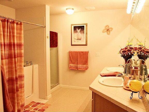 Master Bath w/walkin jetted tub,custom tile floor and countertops