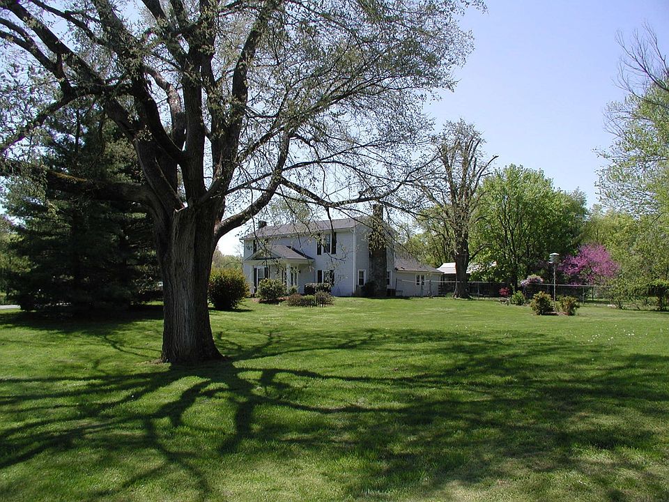 Stately historic home on 3.1 acres. Stone walkway leading to front porch