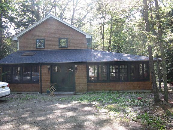 plenty of parking the house is situated on 1.5 acres in the woods to create shade and mellow out storms, yet sunny and inviting with outdoor fire pit and grill