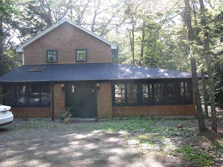 plenty of parking the house is situated on 1.5 acres in the woods to create shade and mellow out storms, yet sunny and inviting with outdoor fire pit and grill