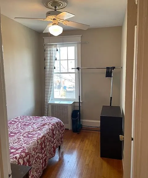 Different picture of 3rd bedroom. Comes with bed, clothes rack, small cube storage, and closet just outside door in hallway.