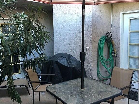 Patio has been updated to 4 cushioned chairs and new umbrella. Also additional seating. Private bbq.