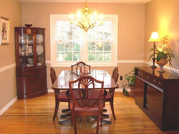 Holiday sized dining room w/hardwood floor.