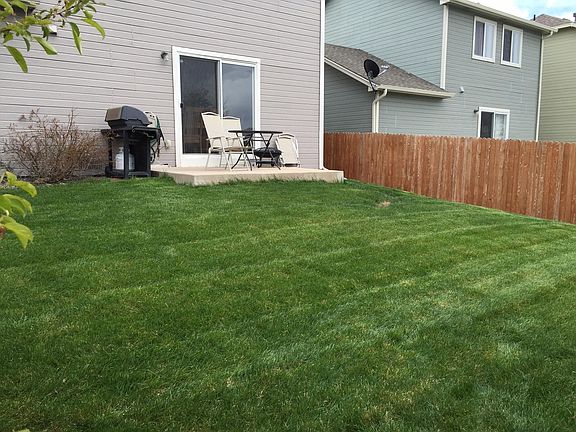 Large, fenced backyard for kids/pets