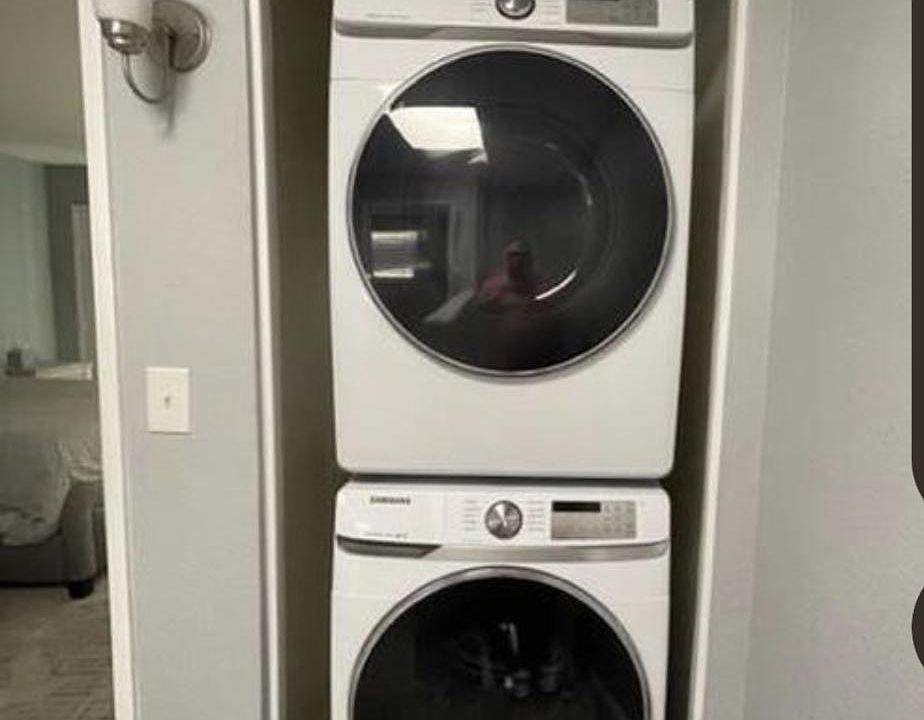 Washer/dryer on upper level at the top of the stairs.