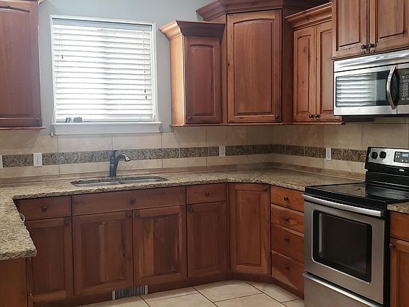 Generous kitchen cabinets and granite countertops