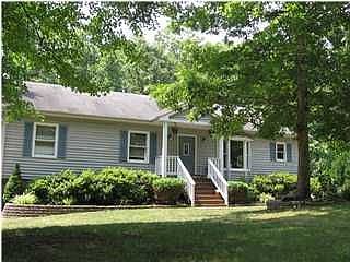 Hardwood floors on the main level, wet bar, huge deck, bay window and more.