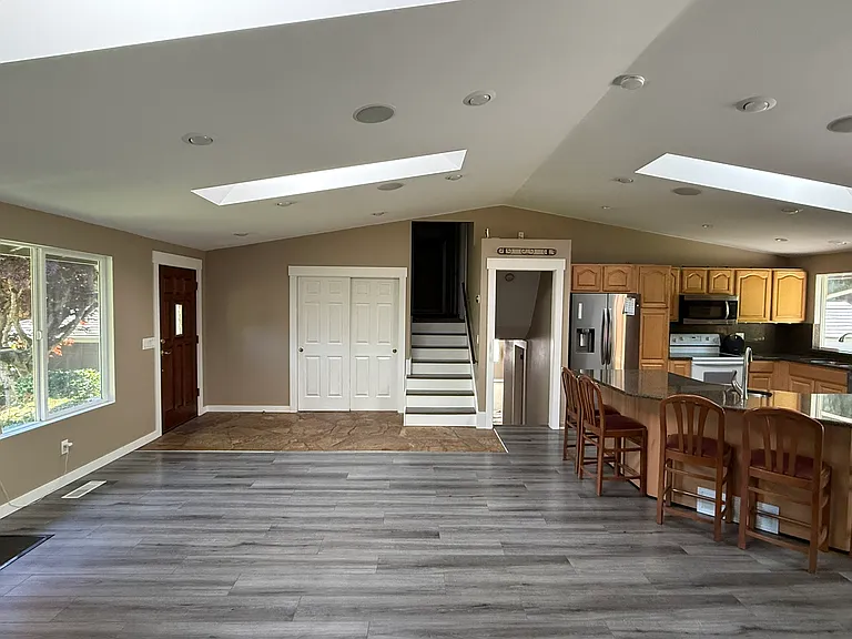 Main Floor. Side view of the main open space (kitchen, dining area and living room)