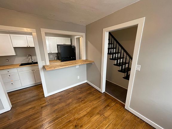 Dining room looking into the kitchen and hallway.