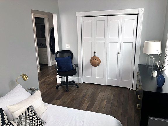 Bedroom with view into living area.