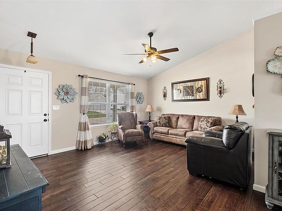 Bright and Open.  The hand scraped hardwood floors are beautiful! upgraded light and ceiling fan and large windows!