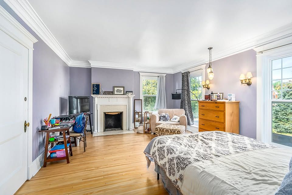 Let the light shine in! __ This historic Duluth mansion features brand-new double-pane windows, blending timeless charm with modern energy efficiency. Additional lightening is a charming teardrop and wall fixtures!