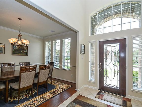 The side lights and large transom at the front entry allow in natural light.