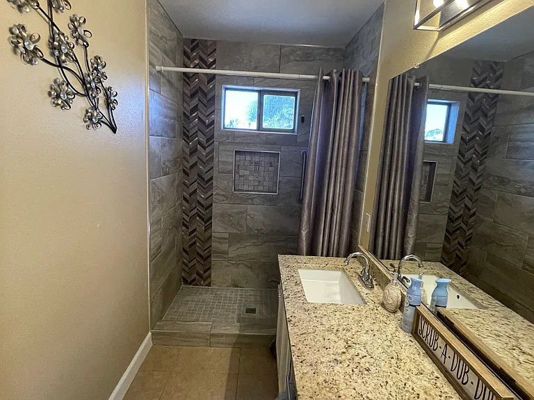 MASTER Ensuite newly upgraded with GRANITE and his and hers contemporary square sinks, new faucets and lighting, custom WALK-in shower with ADA pole for stablity and ADA new toilets in both bathrooms!