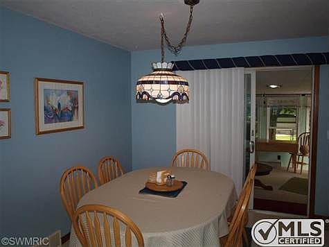 10' x 9' dining area with sliders to 14' x 12' 3-season room and access to new patio and fenced rear
