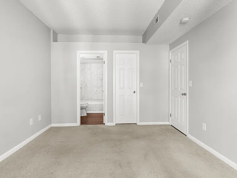 Primary bedroom features a large walk-in closet and private ensuite bathroom.