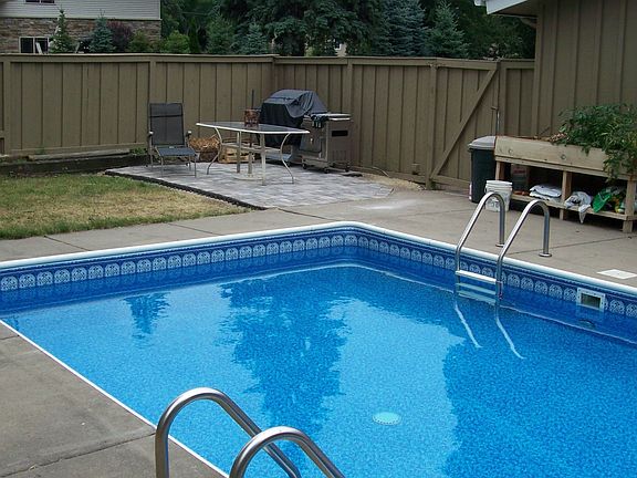 Pool and Paver Patio area in the fenced-in backyard