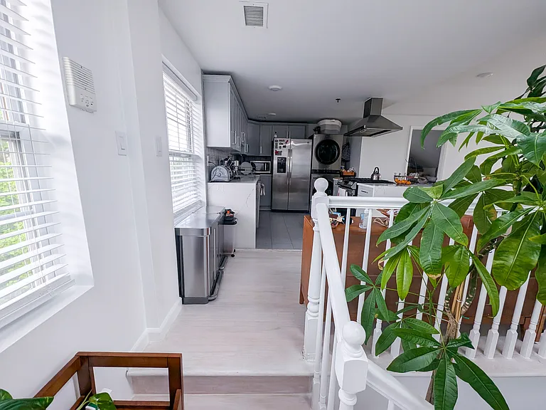 View from staircase into kitchen