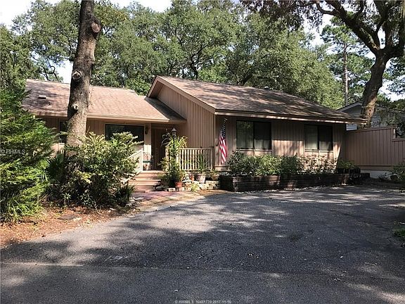 Front of home with parking pad.