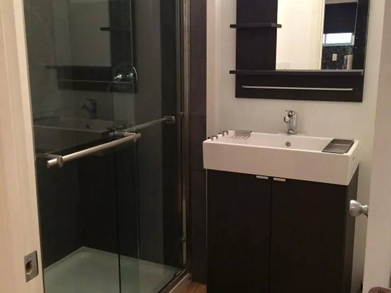Bathroom with modern style shower and sink