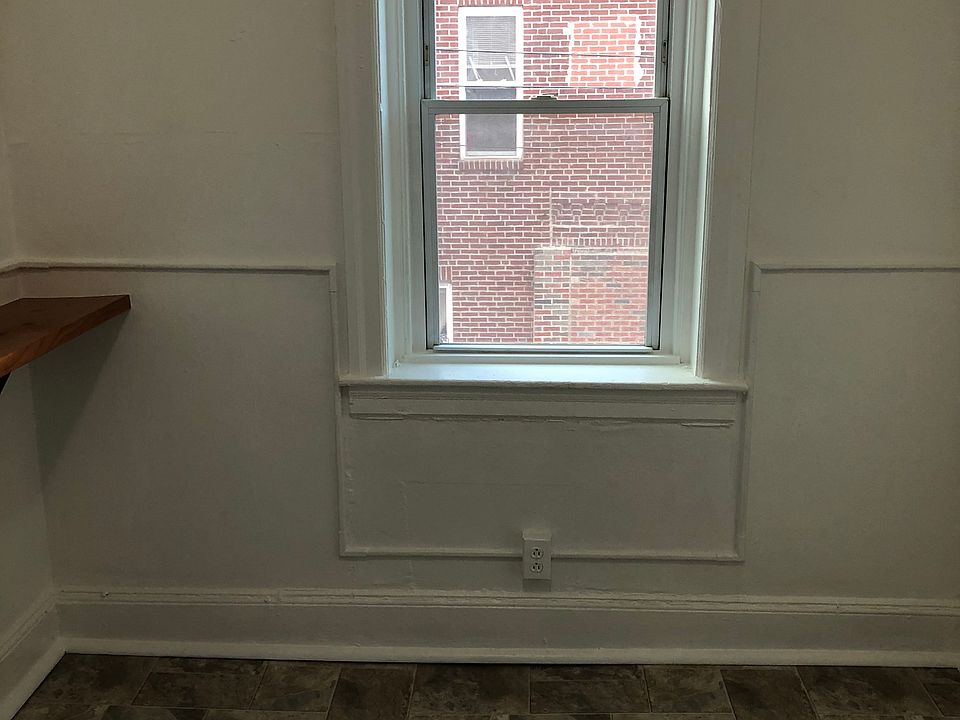Kitchen view opposite the sink has a new floor. The entire apt has been totally repainted.