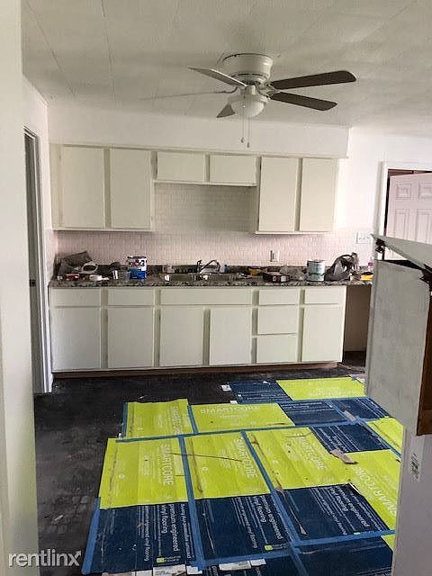 Large eat-in kitchen features lots of cabinet and counter sp