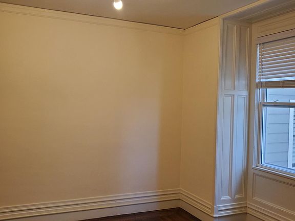 Bedroom, or living room, depending on how you set it up. Large rooms, King size bed fits no problem with side tables and more.