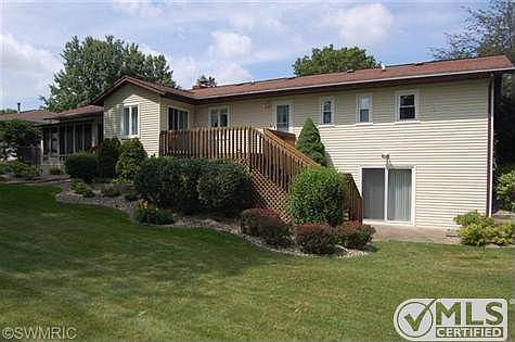 Beautiful landscaped lot, large deck off of dining room and walk-out basement.