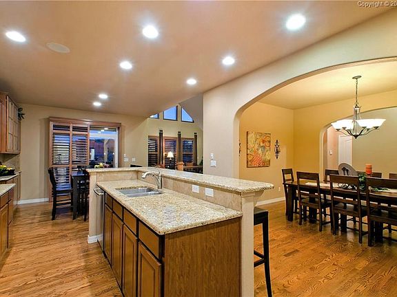 The formal Dining Room opens into the Island Kitchen and Nook w/slider to the ba