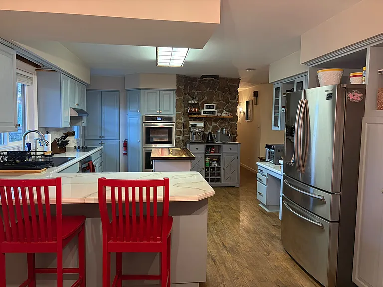 Big kitchen w/butcher block island top. Many upgrades throughout