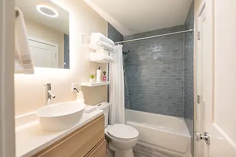 Full bath lies between the two bedrooms, the primary bedroom has a private entrance into the bathroom.