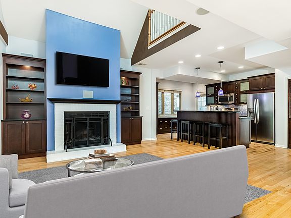 Beautiful built in bookcases flank the spectacular fireplace.