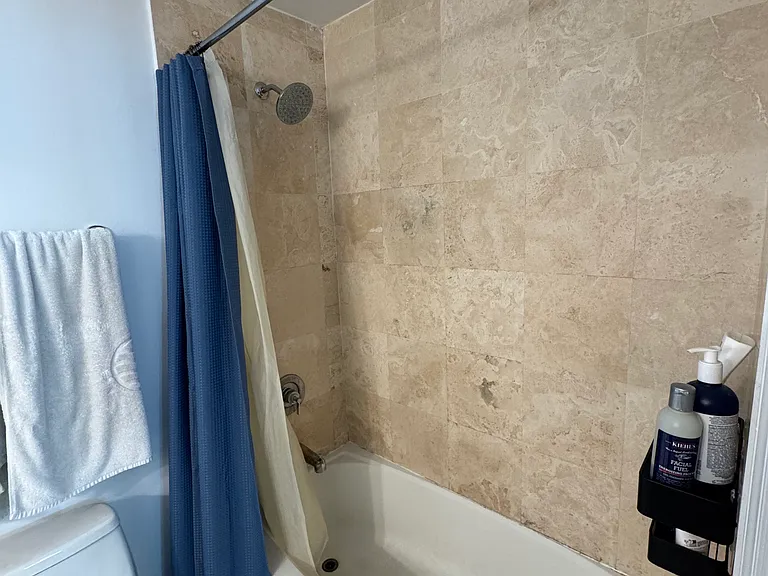 Primary Bathroom - Situated off your primary bedroom, the main bathroom features a stylish shower/tub combo with elegant tile _ideal for both quick showers and relaxing soaks.