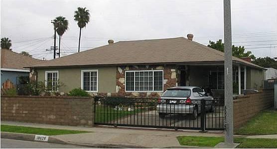 fully fenced front yard with remote control gate