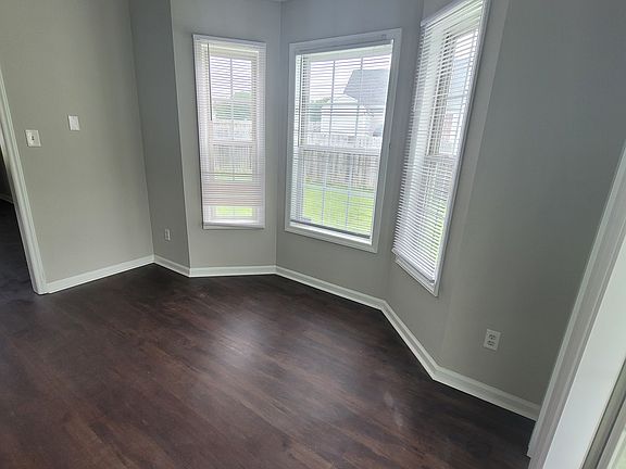 Cozy eat-in with bay window, overlooking the side yard! Opens to back patio for entertaining. Cordless lift blinds throughout.