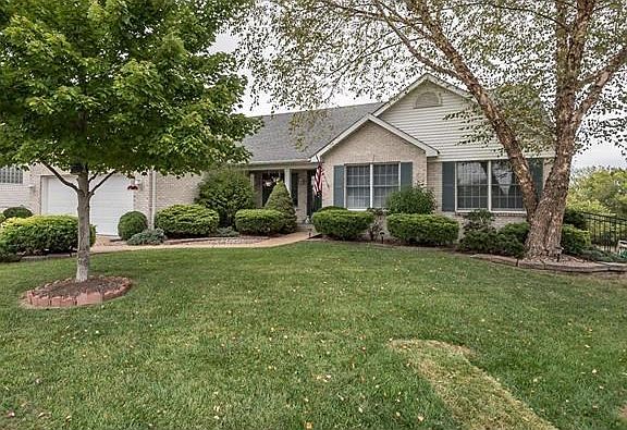 Home has a partial brick front and backyard is fully fenced.