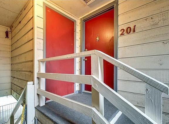 Front entry on right with personal storage room on left.