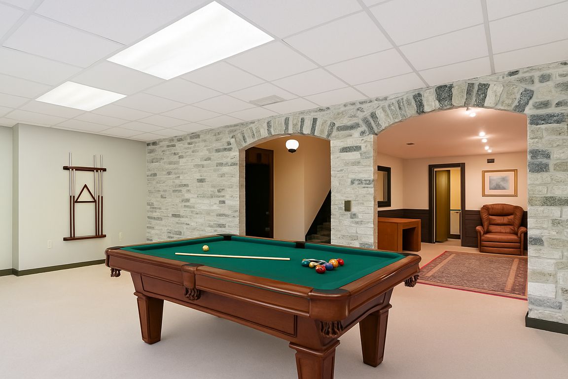 Basement Recreation Room with Stone Archway