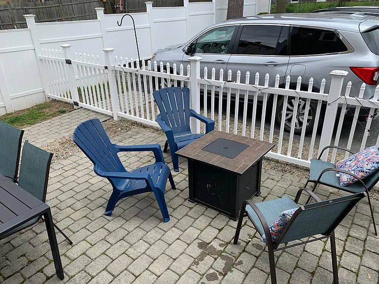 Private patio and fenced in lawn