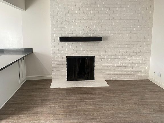 Living Room with Fireplace and Vinyl Plank Flooring