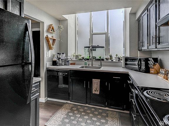 Kitchen is light and bright! The atrium widow has removable privacy adhesive that still allows light in. 