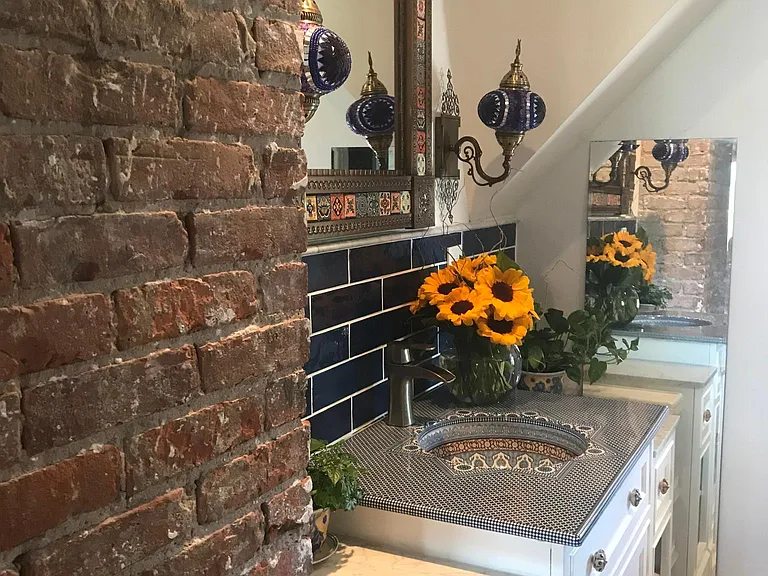 spacious bathroom. At the time this picture was taken, it was adorned with beautiful fresh cut sun flowers