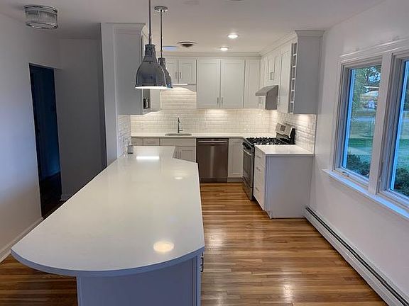 Custom kitchen with gas range stove.