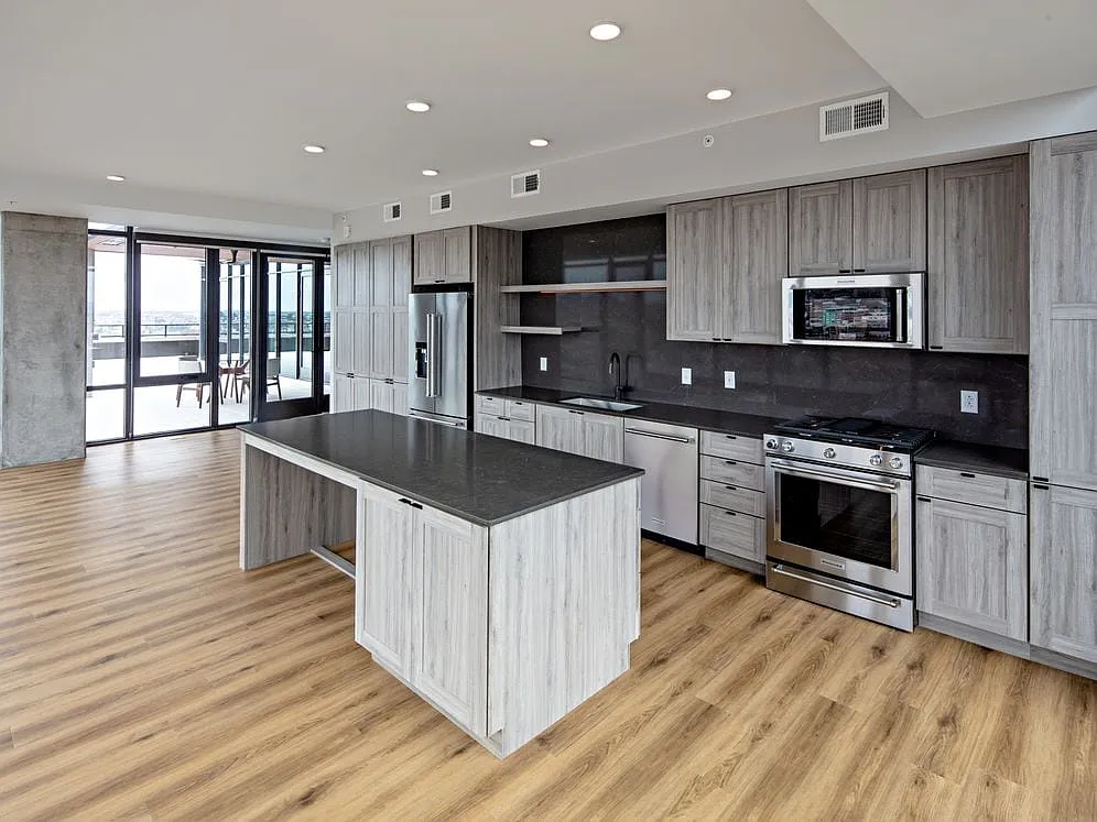 Penthouse-level Signature Collection apartment homes feature kitchens with upgraded finishes and appliances - Avalon 555 President