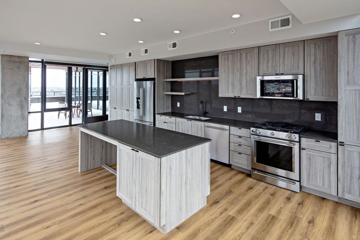 Penthouse-level Signature Collection apartment homes feature kitchens with upgraded finishes and appliances